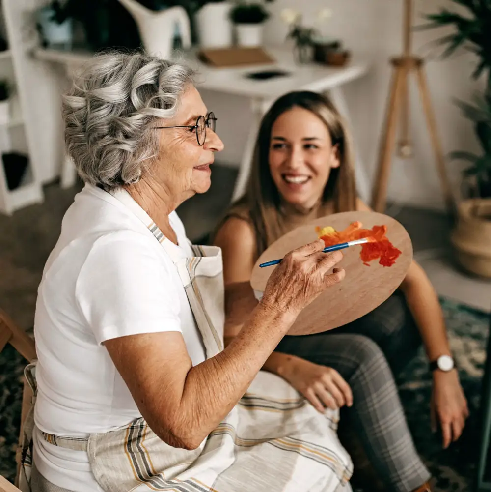 a man and woman smiling and holding a cup of coffee