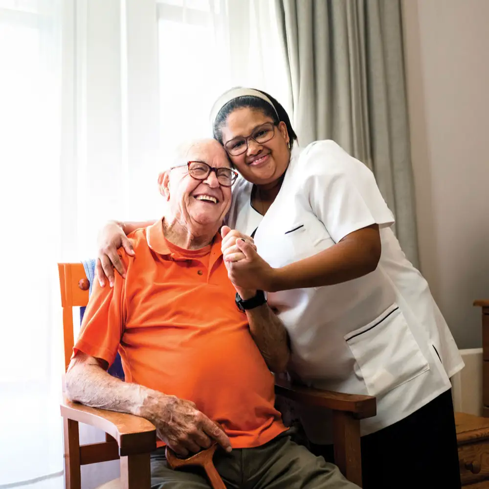 a man and woman smiling and holding a cup of coffee
